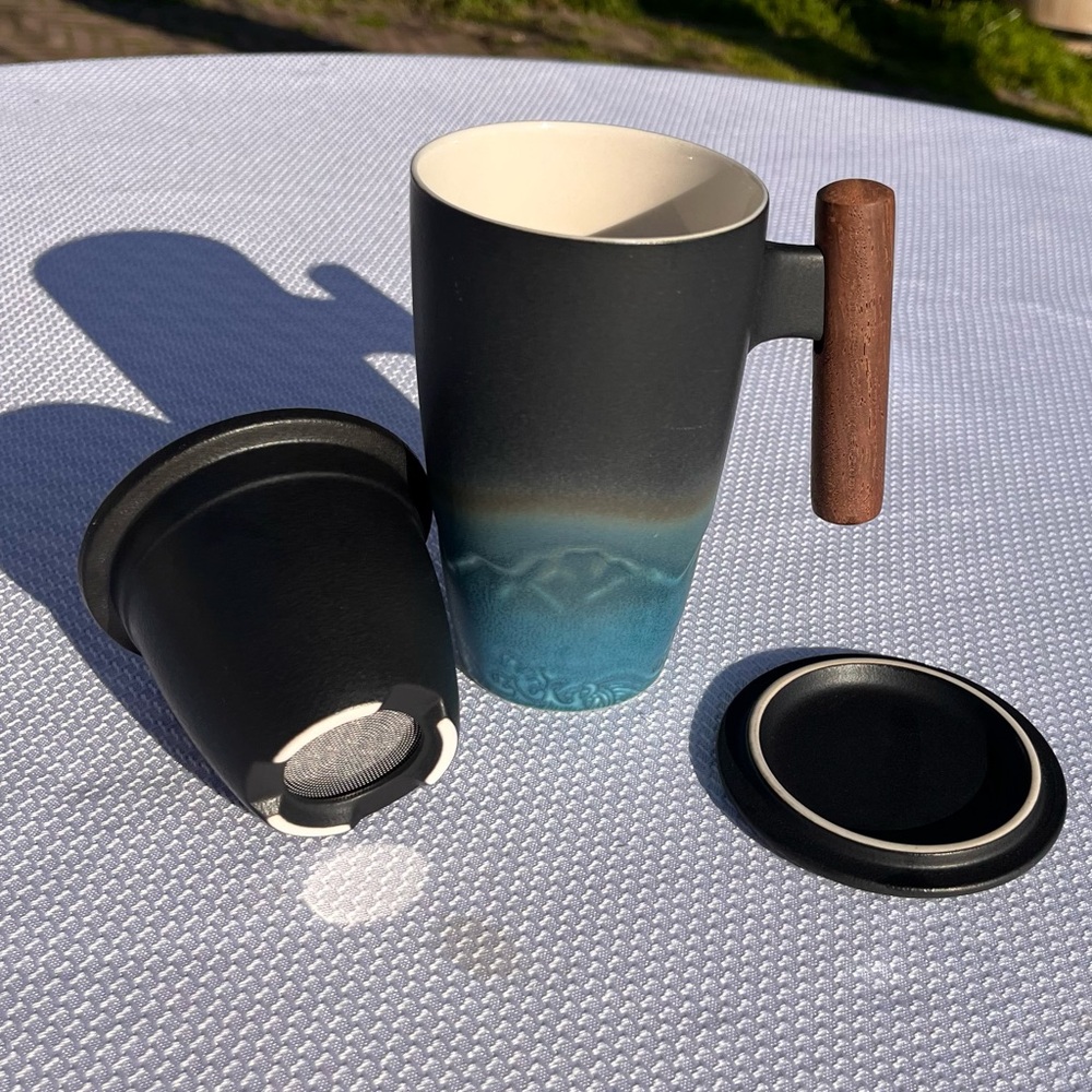 Ceramic tea mug and infuser, with lid. mountain landscape, wooden handle